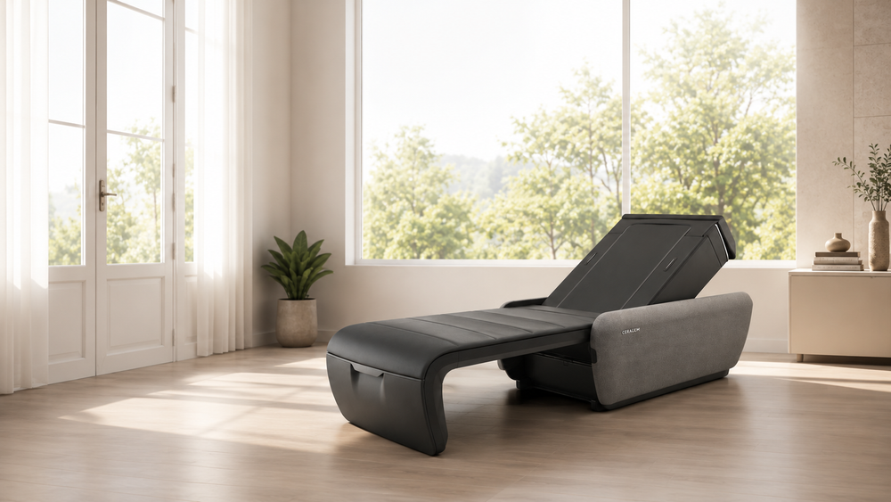 Maseter V9 massage bed in a bright room with large windows and plants.